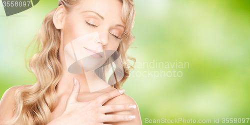 Image of beautiful young happy woman with long hair