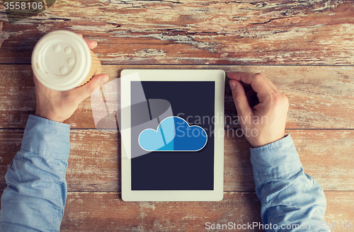 Image of close up of male hands with cloud on tablet pc 