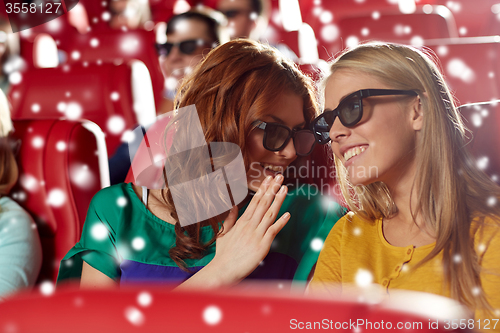 Image of happy women in 3d glasses watching movie at cinema