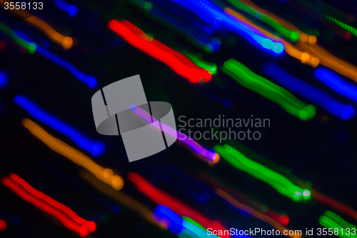Image of colorful bright night lights over black background