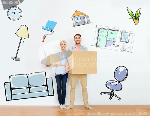 Image of couple with cardboard boxes moving to new home