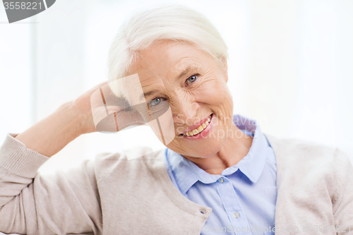 Image of happy senior woman face at home