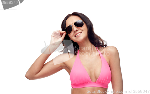 Image of happy woman in sunglasses and bikini swimsuit