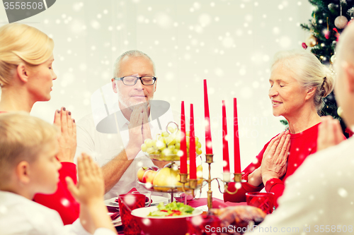 Image of smiling family having holiday dinner at home