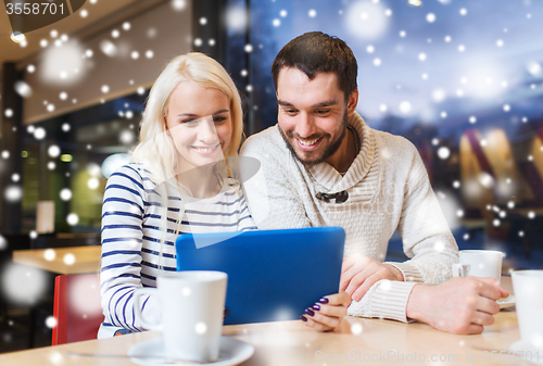Image of happy couple with tablet pc and coffee at cafe