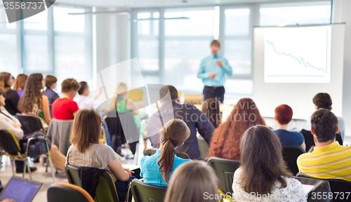 Image of Speaker Giving a Talk at Business Meeting.