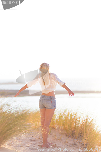 Image of Free Happy Woman Enjoying Sun on Vacations.