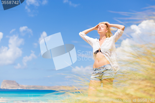 Image of Free Happy Woman Enjoying Sun on Vacations.