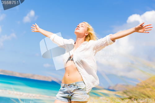 Image of Free Happy Woman Enjoying Sun on Vacations.