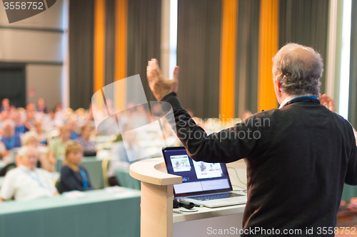 Image of Speaker at Business Conference and Presentation.