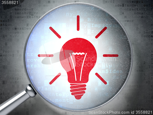 Image of Business concept: Light Bulb with optical glass on digital background
