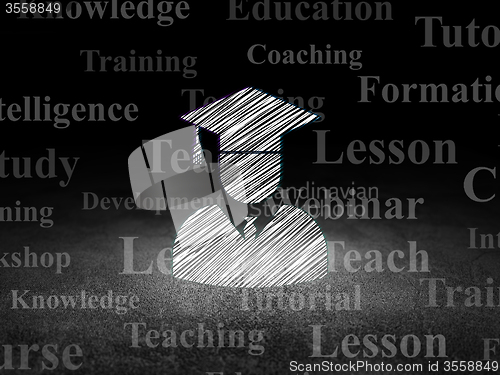 Image of Education concept: Student in grunge dark room
