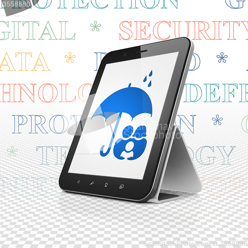 Image of Safety concept: Tablet Computer with Family And Umbrella on display
