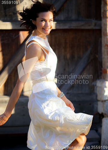 Image of beautiful middle-aged woman in a summer dress