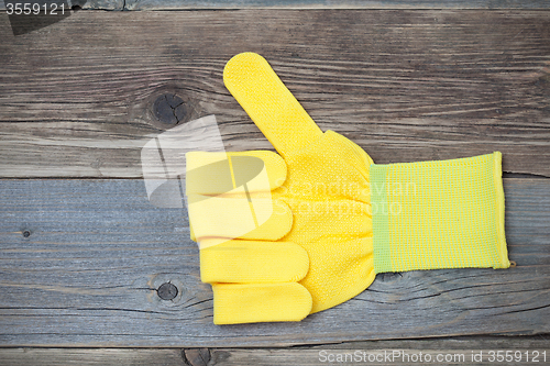 Image of gloves with raised thumb up