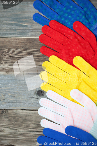 Image of set of colored construction gloves