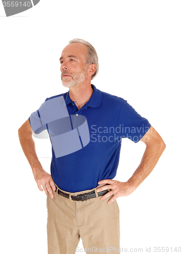 Image of Handsome middle age man in blue t-shirt.