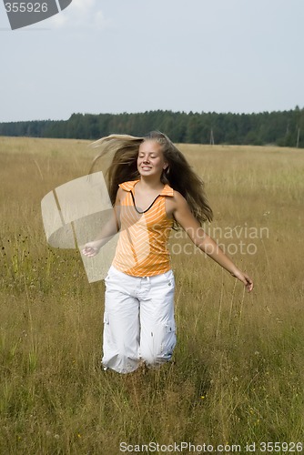 Image of Girl plays on a meadow II