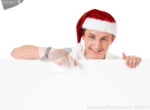 Image of Young man in Santa hat