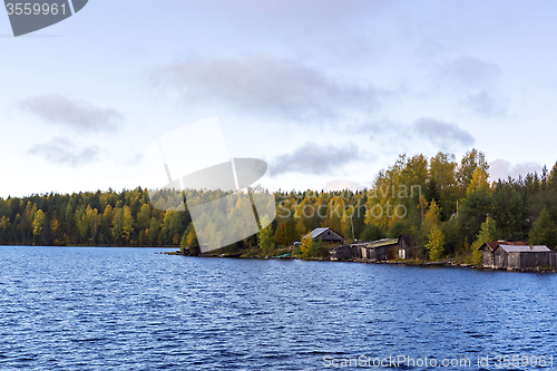 Image of Farm on riverside in autumn taiga