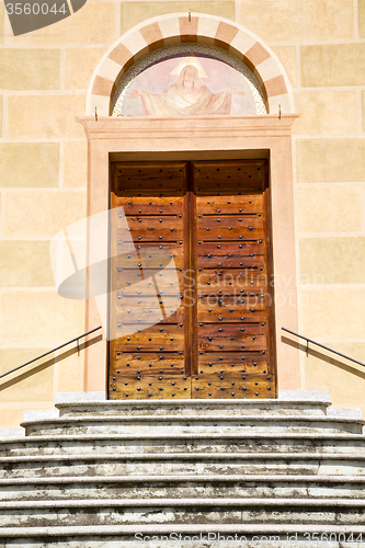 Image of sunny daY italy church tradate    the old door entrance  mosaic