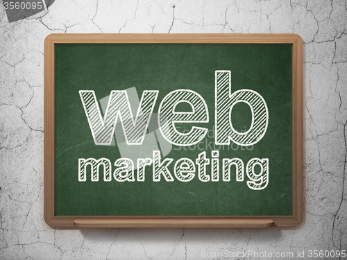 Image of Web development concept: Web Marketing on chalkboard background