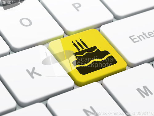 Image of Holiday concept: Cake on computer keyboard background