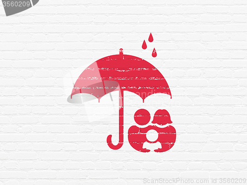 Image of Privacy concept: Family And Umbrella on wall background