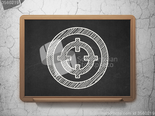 Image of Finance concept: Target on chalkboard background