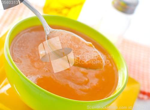 Image of Fresh soup from pumpkin in the green bowl