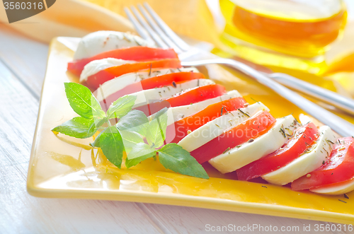 Image of caprese, fresh salad with tomato and mozzarella