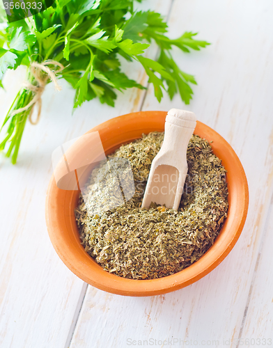 Image of Dry parsley in the bowl, green parsley