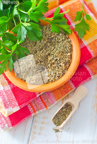 Image of Dry parsley in the bowl, green parsley