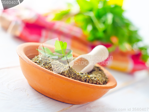 Image of Dry parsley in the bowl, green parsley