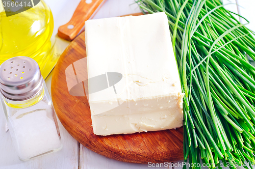 Image of fresh cheese tofu on the wooden board