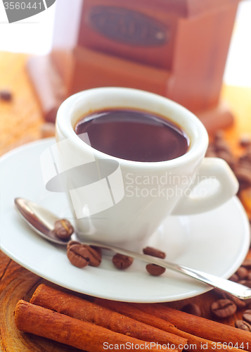 Image of Fresh aroma coffee in the white cup, coffee and cinnamon