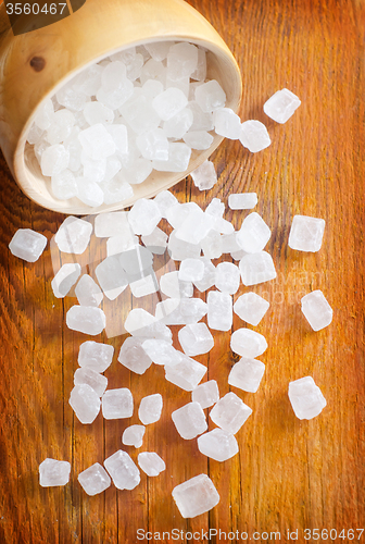 Image of White sugar in the wooden vase