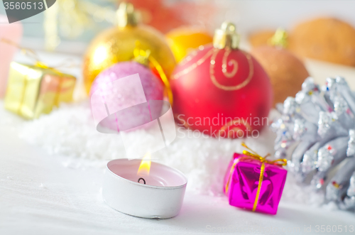 Image of Candle and christmas decoration
