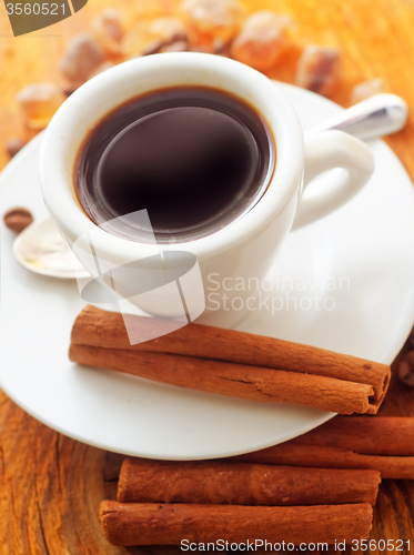 Image of Fresh aroma coffee in the white cup, coffee and cinnamon
