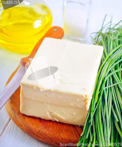 Image of fresh cheese tofu on the wooden board