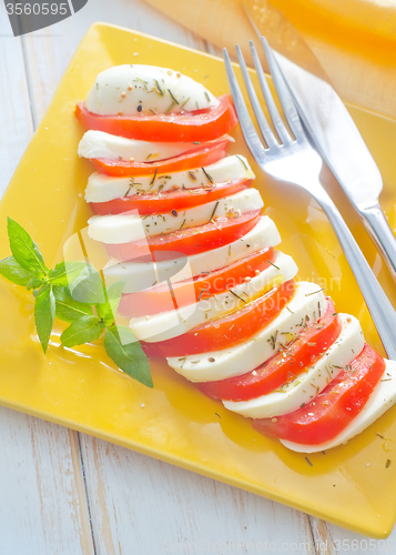 Image of caprese, fresh salad with tomato and mozzarella