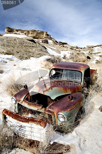 Image of abandoned car in snow