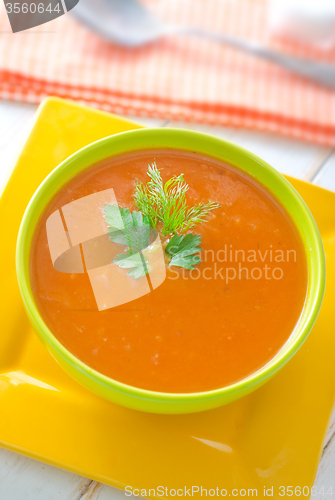 Image of Fresh soup from pumpkin in the green bowl