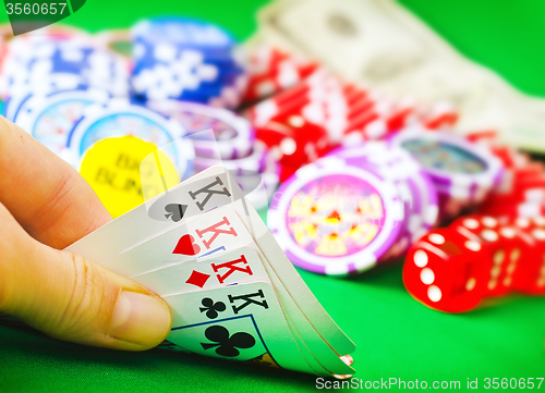 Image of Card for poker in the hand, chips and card for poker