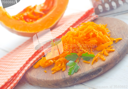 Image of Pumpkin on the wooden board, raw pumpkin