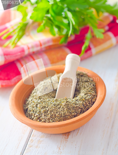 Image of Dry parsley in the bowl, green parsley