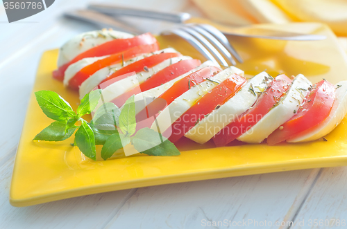 Image of caprese, fresh salad with tomato and mozzarella