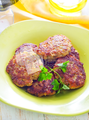 Image of cutlets on the green plate