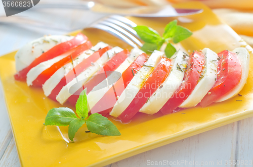 Image of caprese, fresh salad with tomato and mozzarella