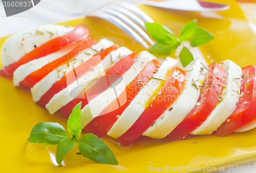 Image of caprese, fresh salad with tomato and mozzarella